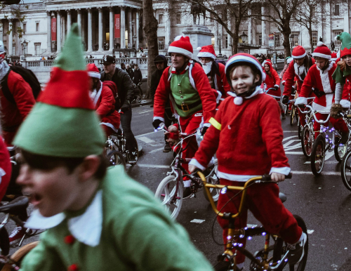 Kid elves on bikes in Christmas Parade